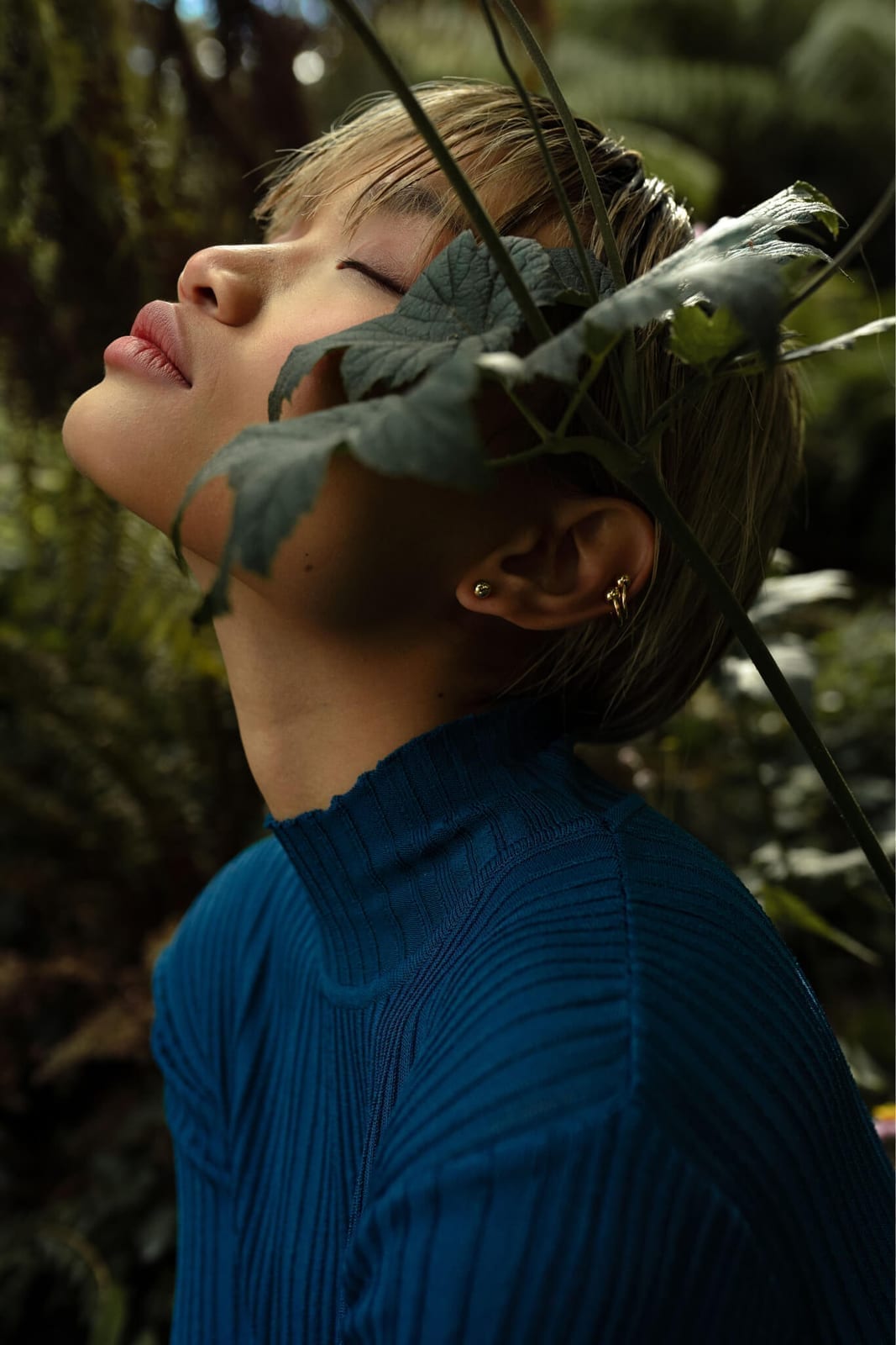 Moody editorial beauty look with luminous skin in natural light